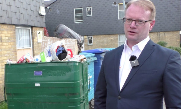 Nigel by overflowing bins