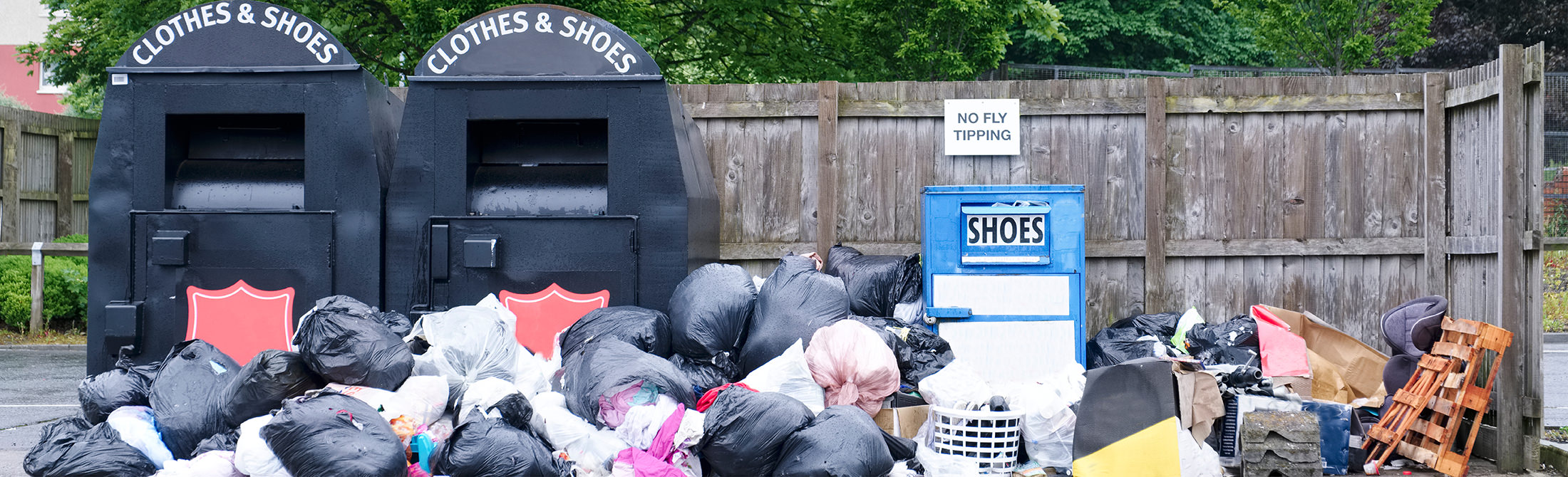 Fly-tipping next to clothing banks