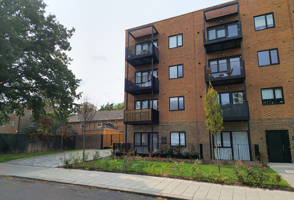 Secure bike hub outside new build apartment blocks