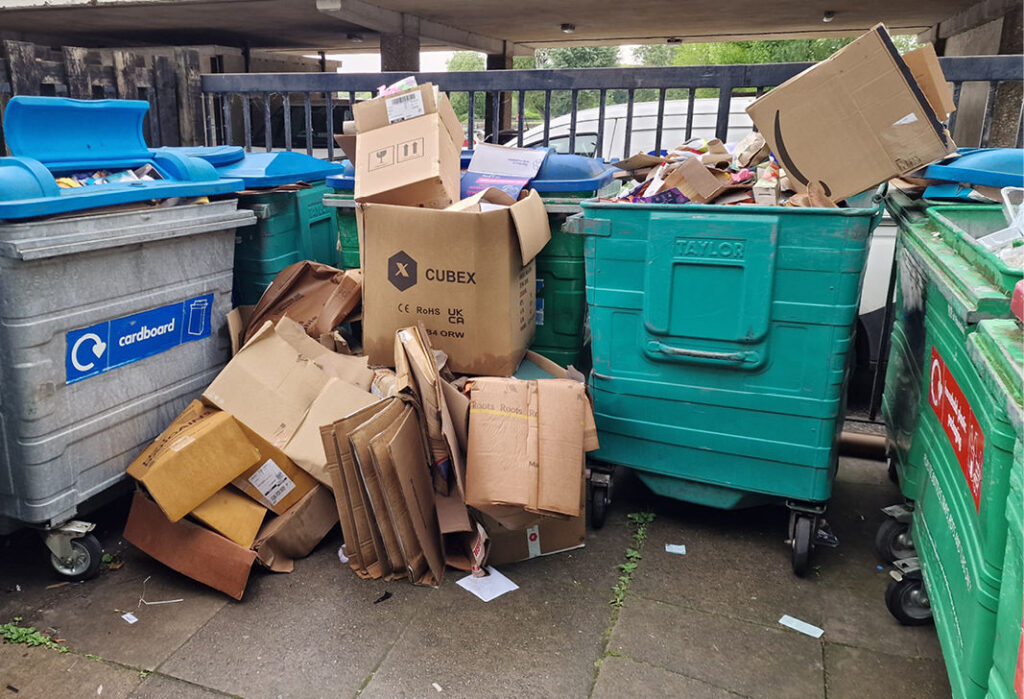 Overflowing communal wheelie bins